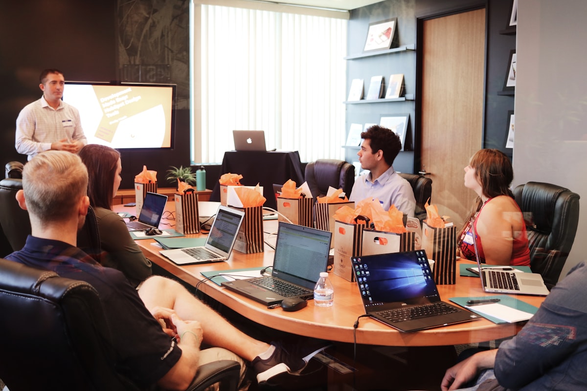 Content marketing team reviewing campaign assets including video, social posts, and email designs